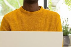 smiling-african-american-man-in-yellow-sweater-usi-2024-11-05-19-46-51-utc